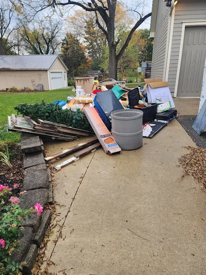 Dumpster being loaded with debris for Commercial Dumpster Rental in Hidden Valley